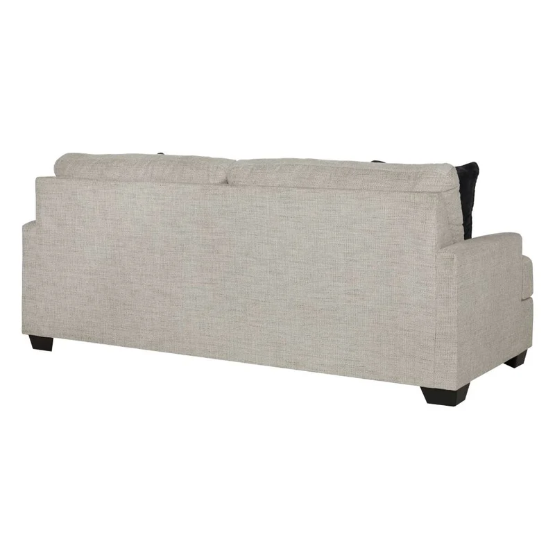Sofa condo en tissu beige pâle avec coussins - Vayda