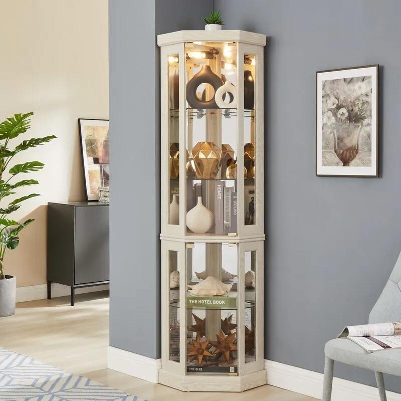 Vitrine d'angle élégante avec éclairage intégré Idéale pour exposer des objets de collection, de la verrerie ou des éléments de décoration.