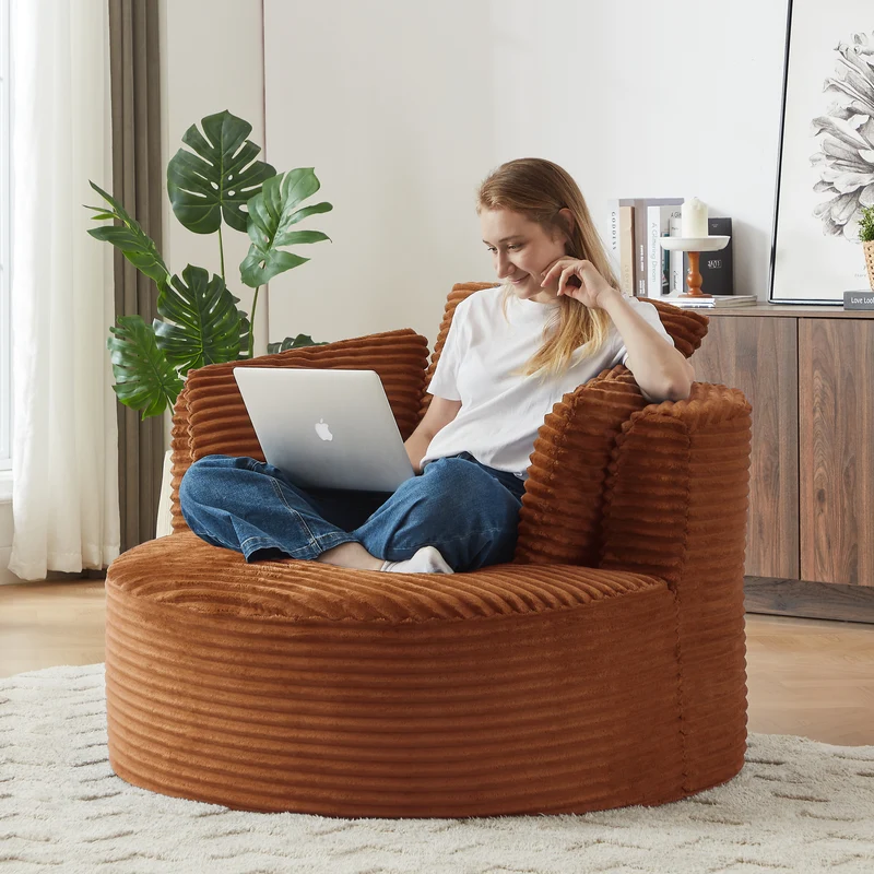 Fauteuil rond lounge en velours côtelé orange, assise profonde ADJUSTIRONSTYLE
