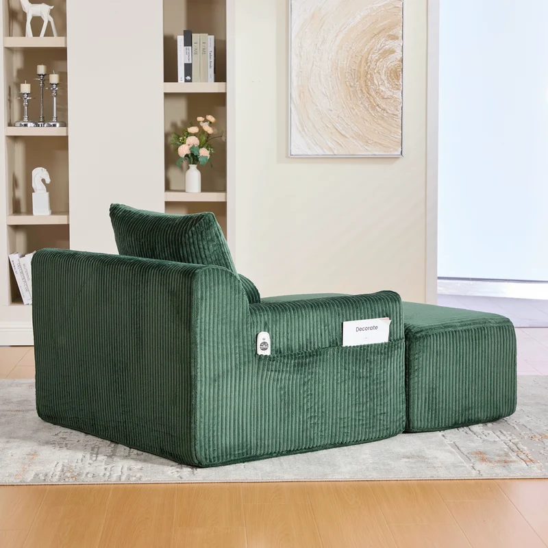 Canapé simple fauteuil XXL en velours côtelé vert, dossier profond, repose pied, coussin & poches latérales, sans montage MILKWEEDFLOSS