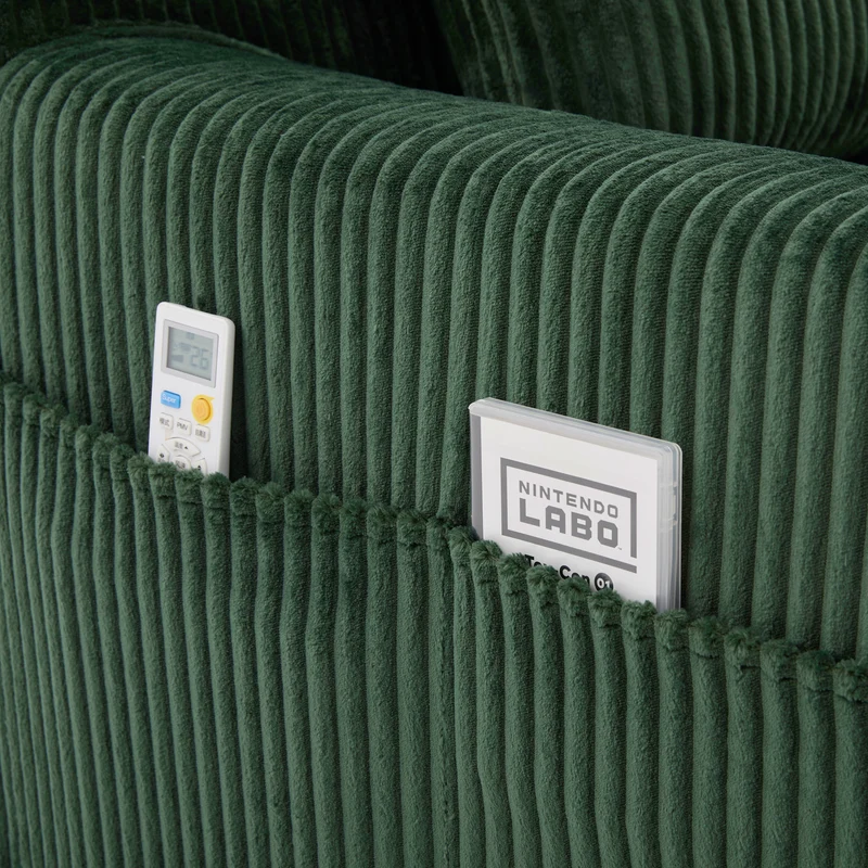 Canapé simple fauteuil XXL en velours côtelé vert, dossier profond, repose pied, coussin & poches latérales, sans montage MILKWEEDFLOSS