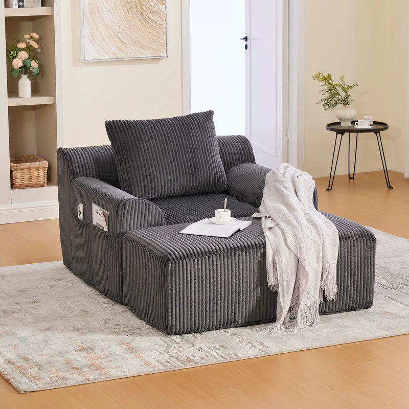 Canapé simple fauteuil XXL en velours côtelé gris, dossier profond, repose pied, coussin & poches latérales, sans montage HOTSPRINGPOOL